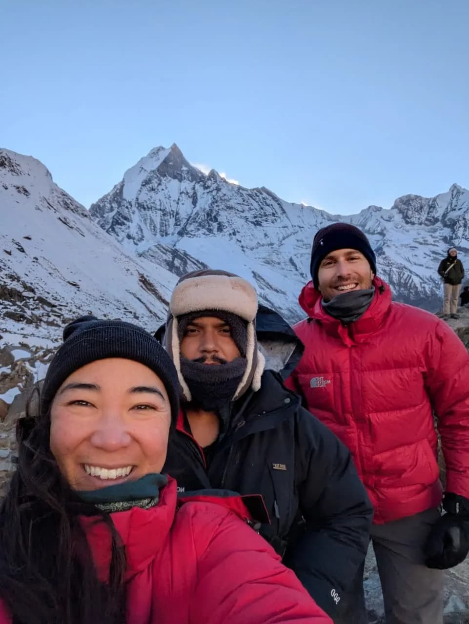 trekkers enjoying the morning view from annapurna base camp