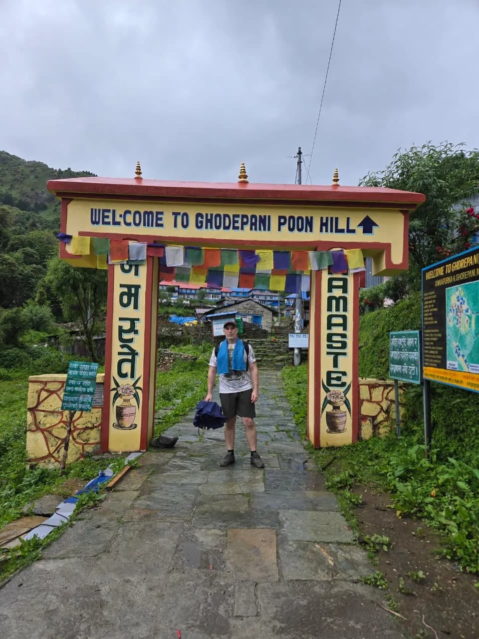 a trekker standing infront of entrance of ghorepani poonhill